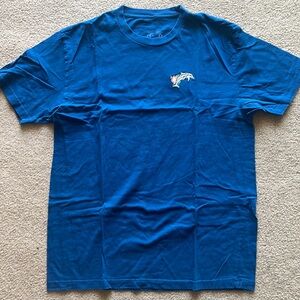 Blue Tshirt with Small embroidered dolphin and flower logo